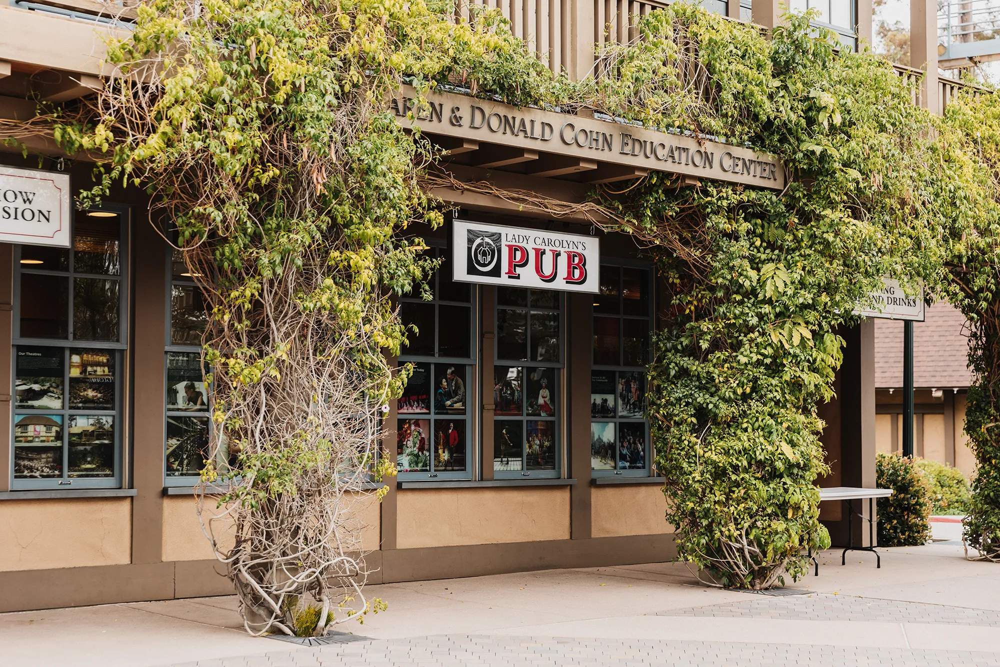 Lady Carolyn Pub entrance surrounded by green ivy